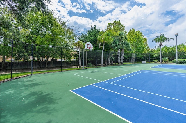 view of sport court with basketball hoop