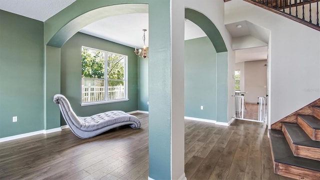 sitting room with dark hardwood / wood-style flooring