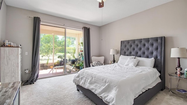 carpeted bedroom featuring access to outside and ceiling fan