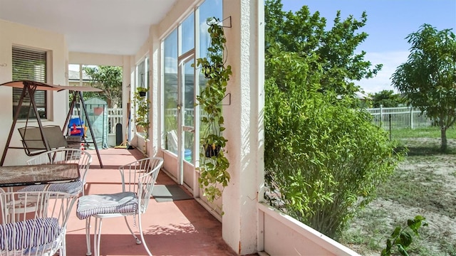 sunroom / solarium with a healthy amount of sunlight