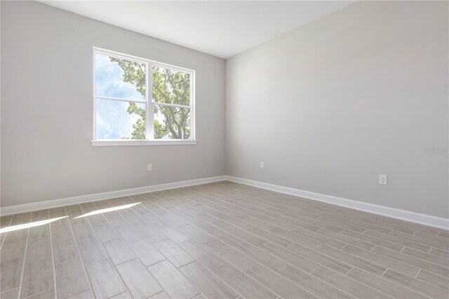 spare room with light hardwood / wood-style floors