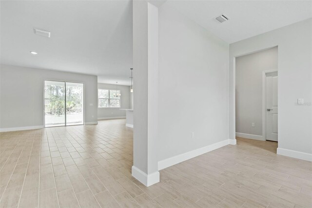 empty room with light hardwood / wood-style floors