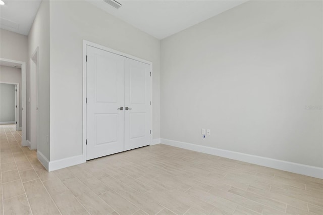 unfurnished bedroom with a closet