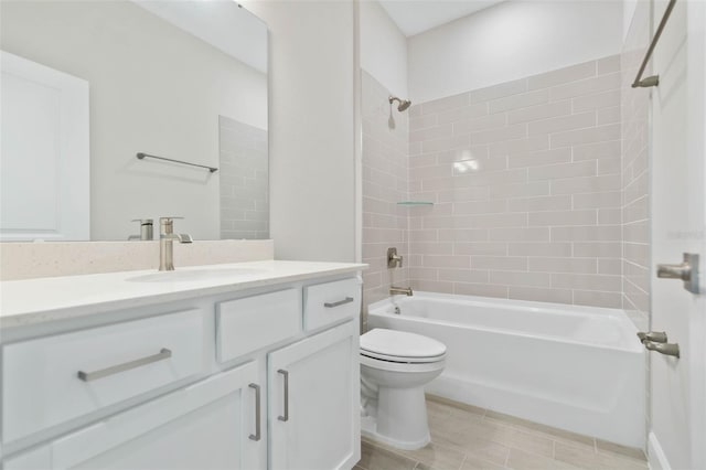 full bathroom featuring tiled shower / bath combo, vanity, and toilet