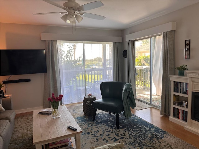 610 Ocean Marina Dr Unit 106, Flagler Beach, FL 32136 - living area featuring baseboards, wood finished floors, and a ceiling fan