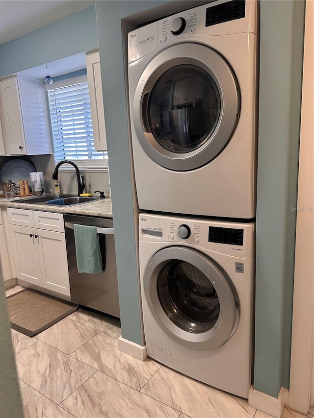 610 Ocean Marina Dr Unit 106, Flagler Beach, FL 32136 - laundry room featuring marble finish floor, stacked washer and dryer, a sink, and laundry area