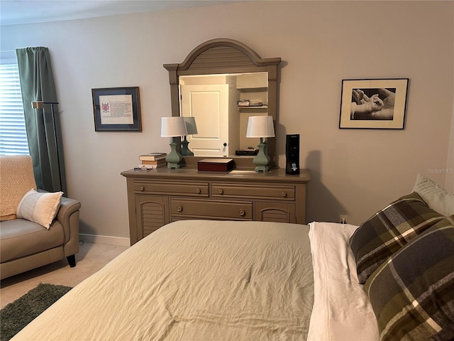 610 Ocean Marina Dr Unit 106, Flagler Beach, FL 32136 - bedroom with baseboards and light carpet