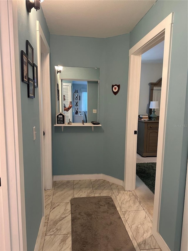 610 Ocean Marina Dr Unit 106, Flagler Beach, FL 32136 - hall with baseboards and marble finish floor