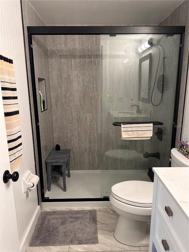 610 Ocean Marina Dr Unit 106, Flagler Beach, FL 32136 - bathroom featuring marble finish floor, toilet, a stall shower, and vanity