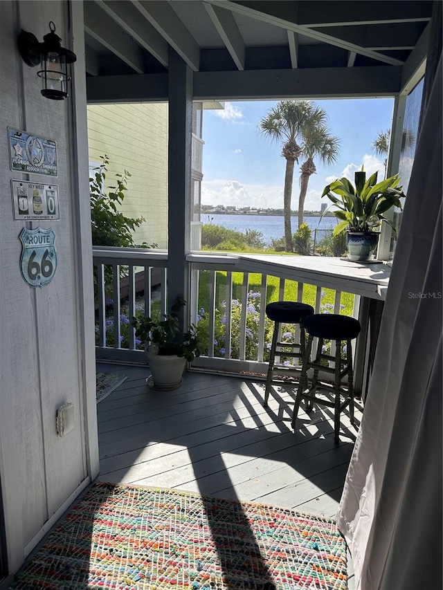 balcony featuring a water view