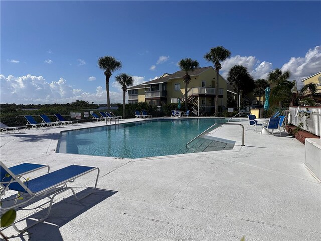 view of swimming pool featuring a patio area