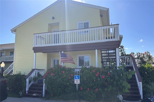 view of front of house featuring a balcony