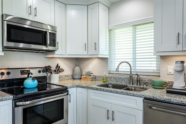 kitchen featuring white cabinetry, sink, and stainless steel appliances