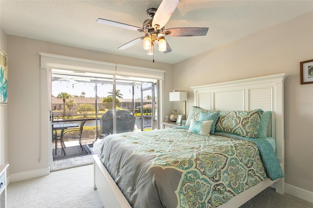 bedroom with a textured ceiling, ceiling fan, light colored carpet, and access to exterior