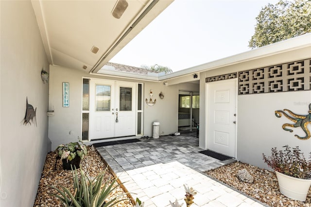 doorway to property with a patio