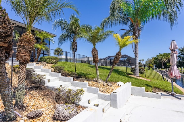 view of home's community featuring a lawn