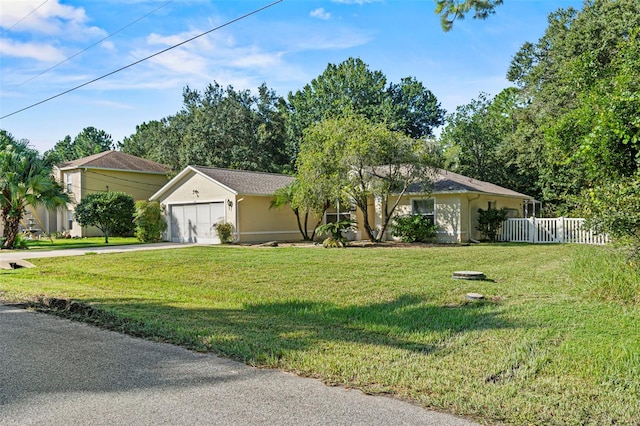 single story home with a front yard and a garage