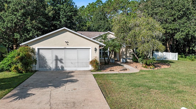 ranch-style house with a front yard and a garage