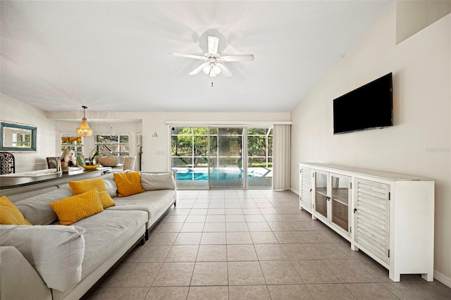 tiled living room featuring lofted ceiling and ceiling fan