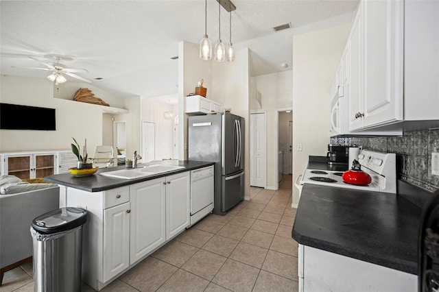 kitchen featuring sink, vaulted ceiling, pendant lighting, white cabinetry, and white appliances