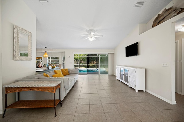 122 Lindsay Dr, Palm Coast, FL 32137 - tiled living room featuring ceiling fan and vaulted ceiling