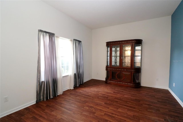 spare room featuring dark hardwood / wood-style floors