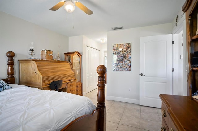 bedroom featuring a closet, ceiling fan, and light tile patterned flooring