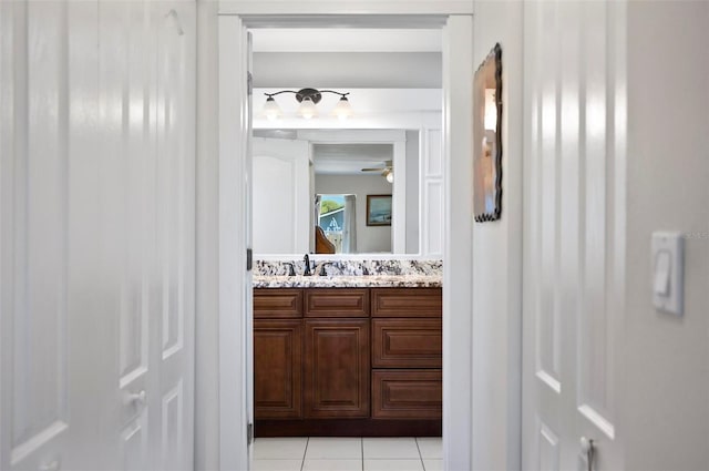 bathroom with ceiling fan, vanity, and tile patterned floors