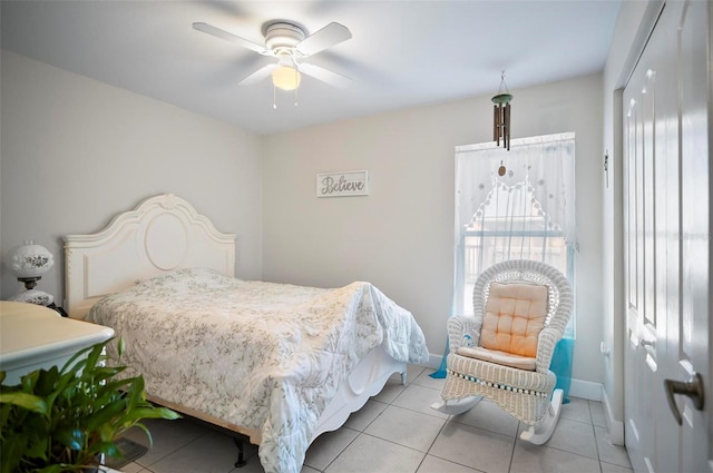 bedroom featuring light tile patterned flooring and ceiling fan