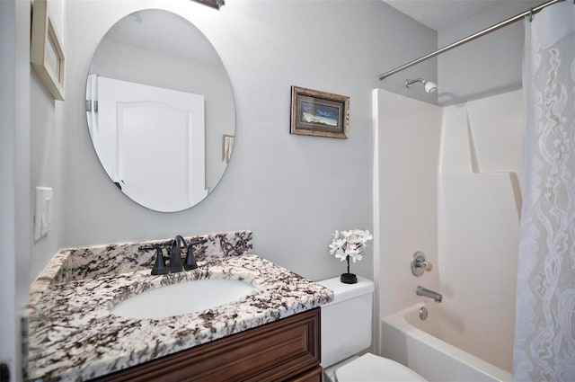 full bathroom featuring shower / bath combo, vanity, and toilet