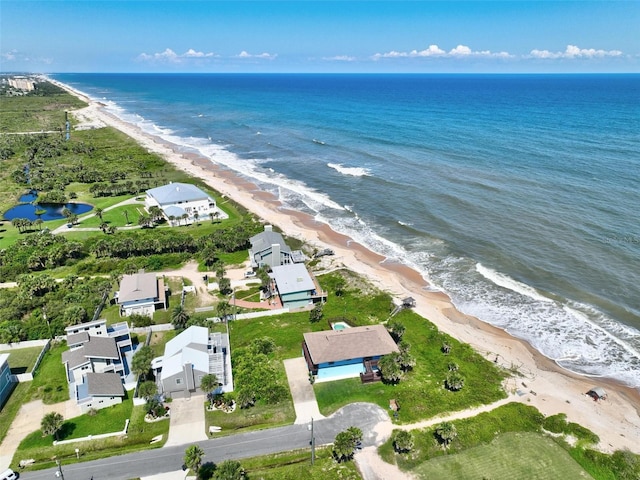 birds eye view of property featuring a water view and a view of the beach