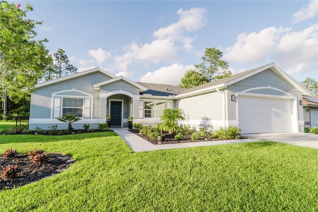 ranch-style home with a garage and a front yard