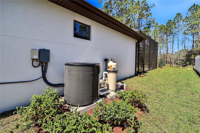 details with stucco siding and central air condition unit