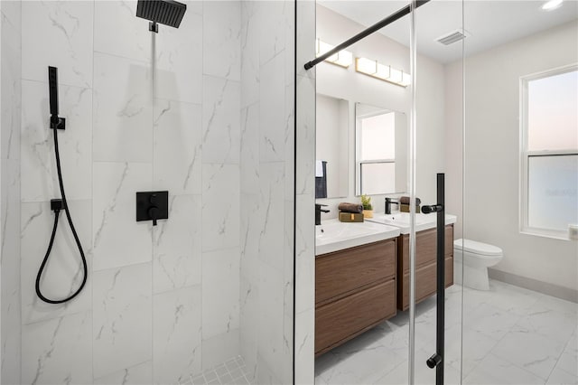 full bathroom featuring toilet, vanity, visible vents, marble finish floor, and a marble finish shower