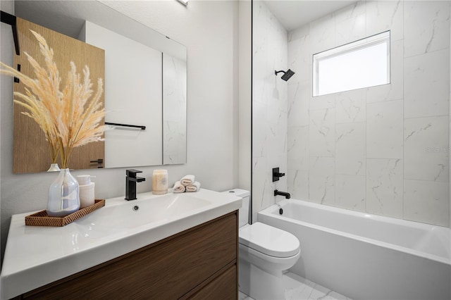 bathroom with marble finish floor, shower / washtub combination, vanity, and toilet