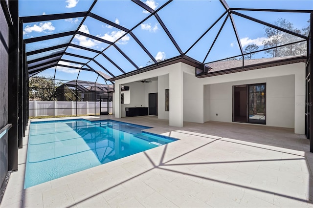 view of pool featuring a fenced in pool, a lanai, a patio, and ceiling fan