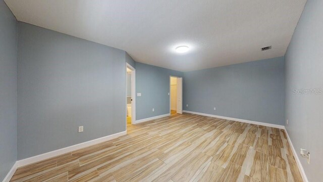 unfurnished room with light hardwood / wood-style flooring