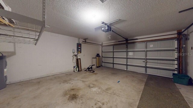 garage with a garage door opener, electric panel, and water heater