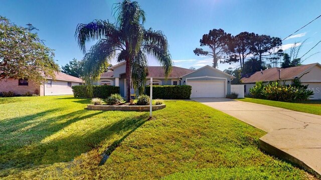 ranch-style home with a garage and a front yard