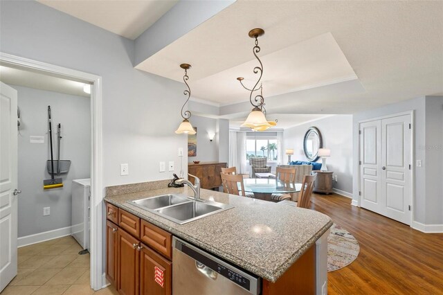 kitchen featuring hanging light fixtures, sink, wood-type flooring, dishwasher, and crown molding