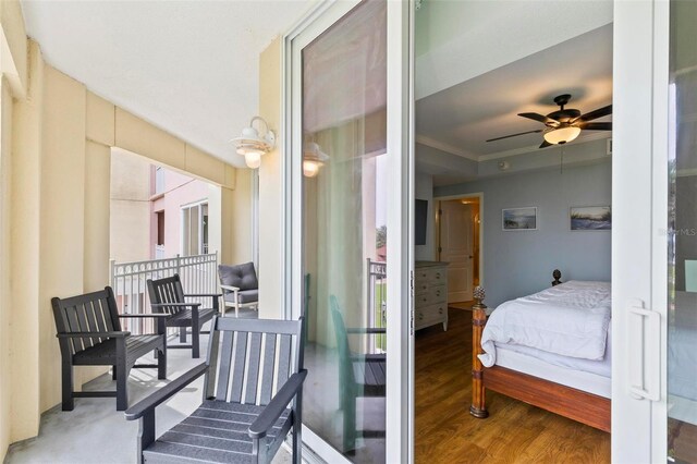 bedroom with ceiling fan and hardwood / wood-style floors