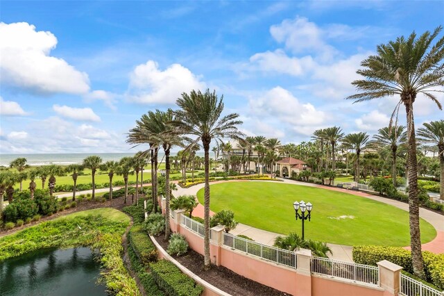 view of home's community featuring a water view and a yard