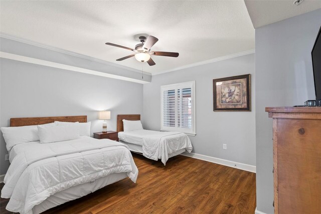 bedroom with ceiling fan, dark hardwood / wood-style floors, and crown molding