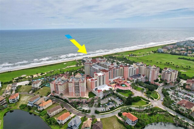 aerial view featuring a view of the beach and a water view