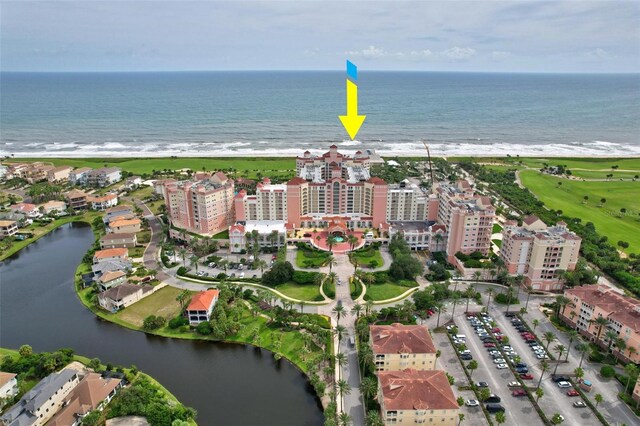 bird's eye view featuring a beach view and a water view