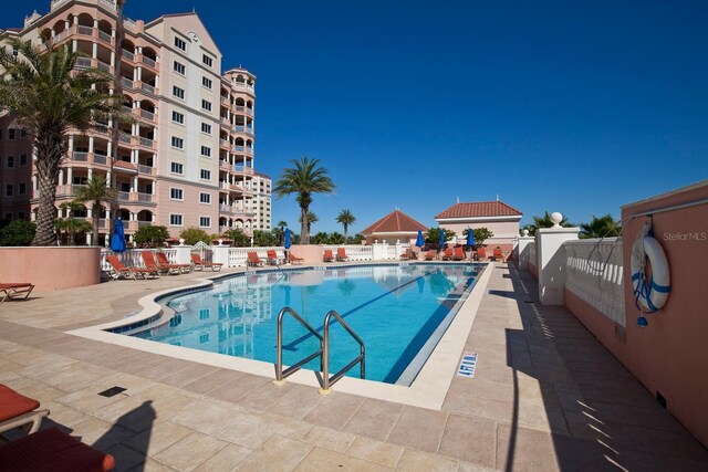 view of swimming pool featuring a patio area