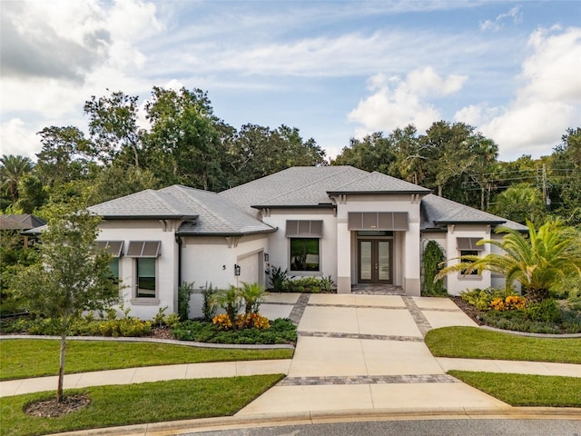 prairie-style home with a front lawn