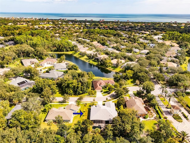 birds eye view of property featuring a water view