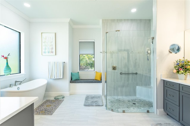 bathroom featuring vanity, crown molding, and separate shower and tub