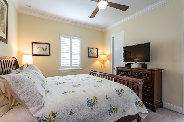 bedroom featuring ceiling fan, ornamental molding, and light wood-type flooring